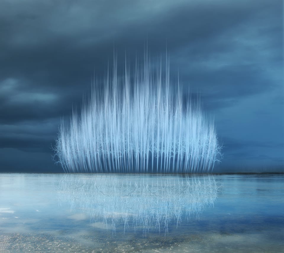 Surreal blue landscape with ethereal tree reflection and dark stormy sky, creating a mystical, dreamlike atmosphere.